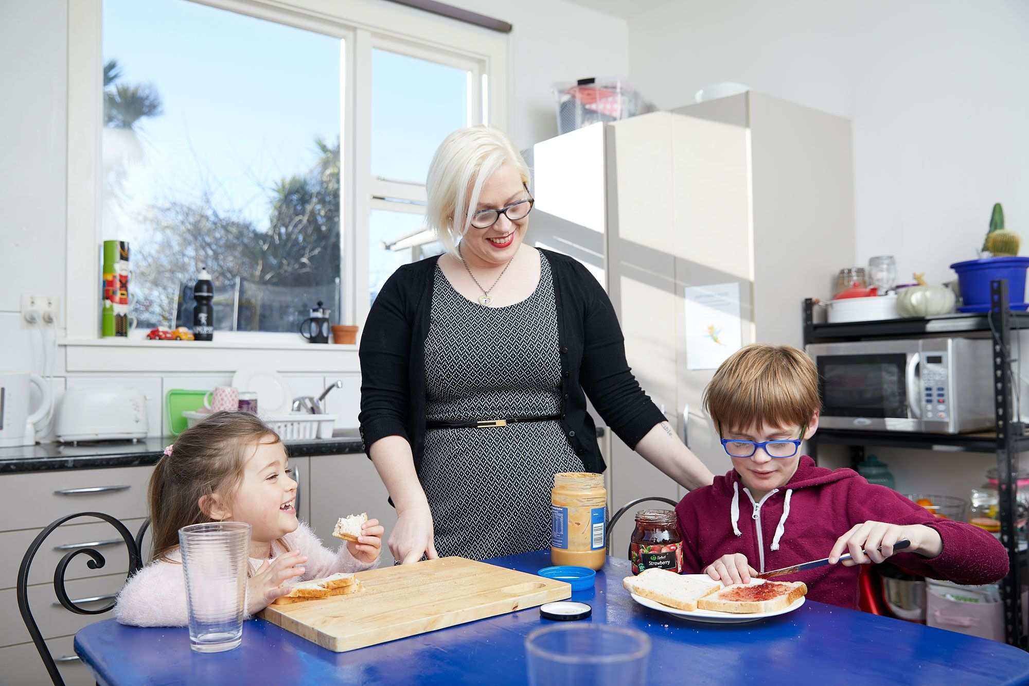Loren prepares lunch with her children
